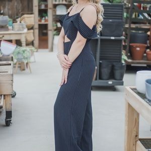 Navy striped jumpsuit. Size: L